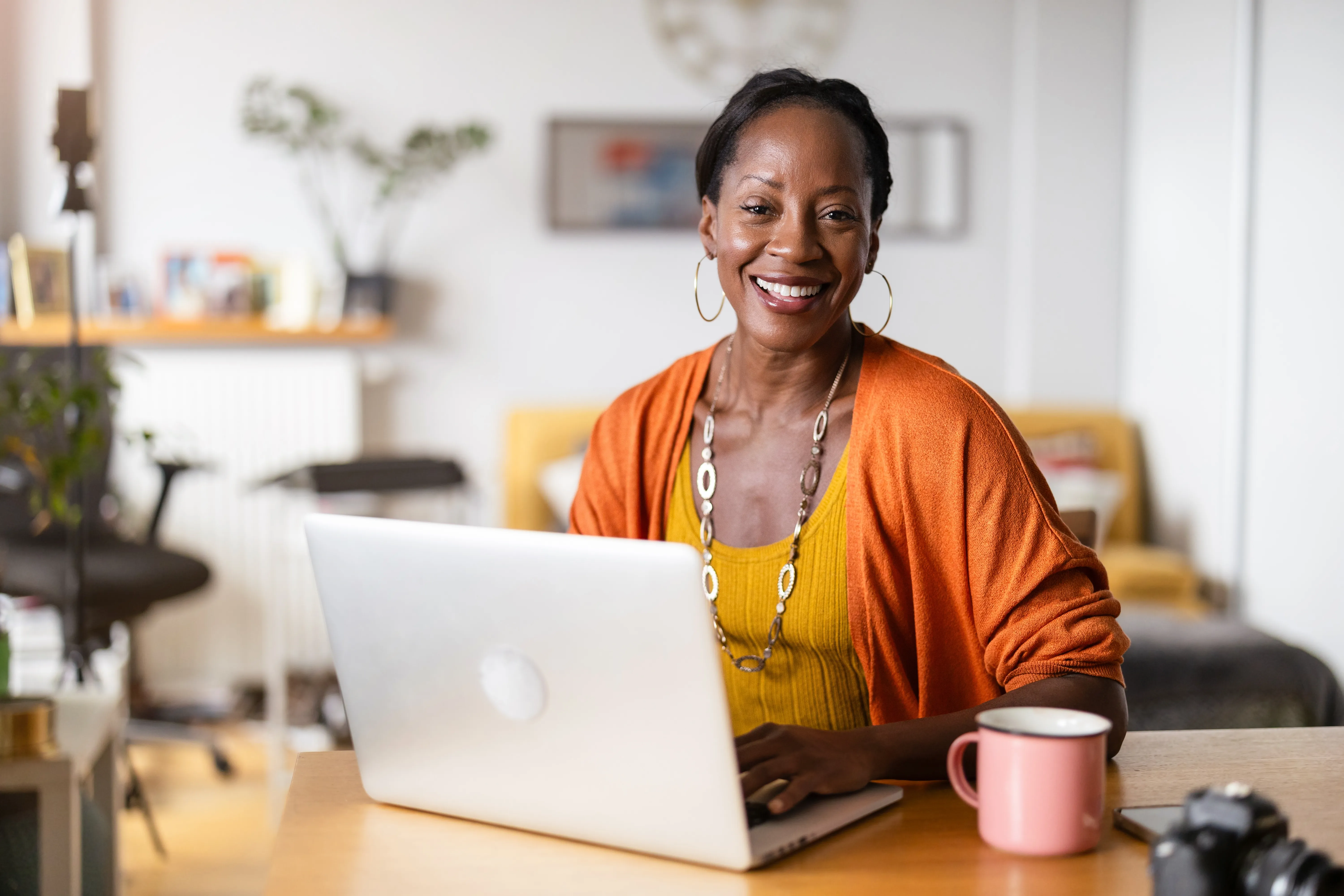 Woman working on laptop for ITIN application